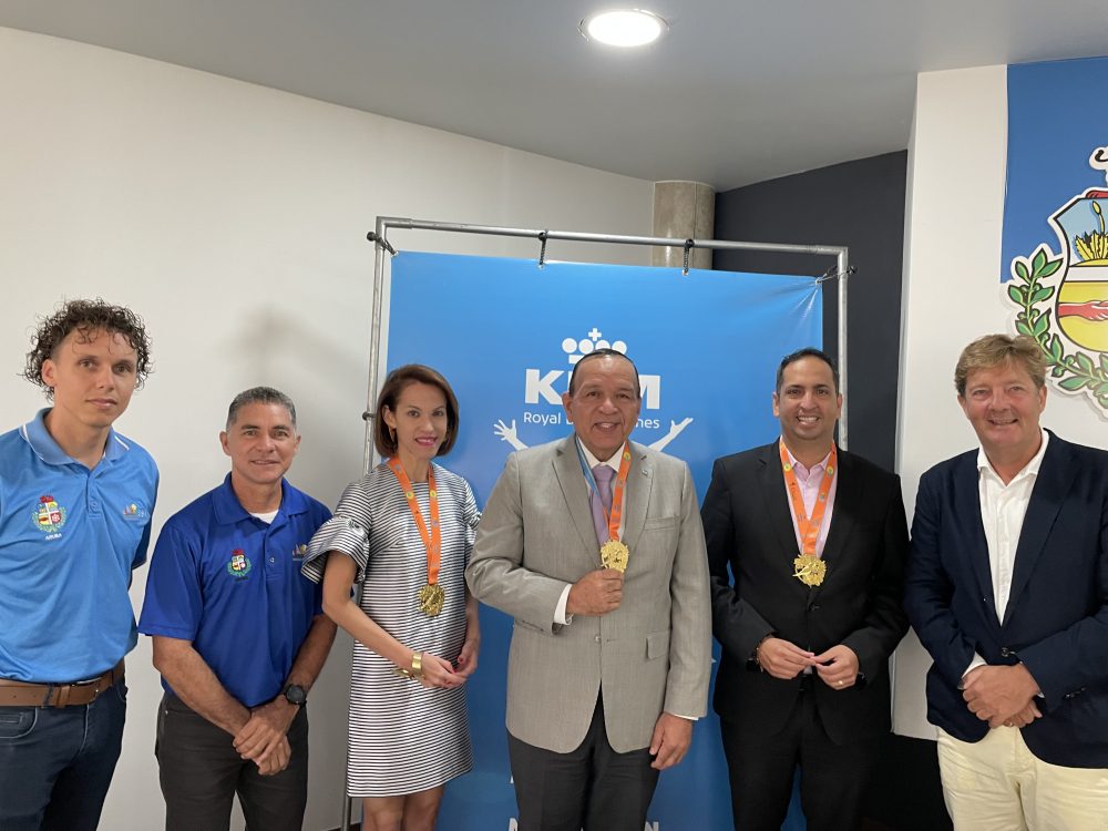 Minister Oduber, Minister Croes and Ronella Croes, CEO at Aruba Tourism Authority receive the first Official finisher Medal